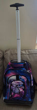 Load image into Gallery viewer, Purple Galaxy Rolling Backpack, featuring a vibrant pink, purple, and blue nebula or galaxy print with an extended telescopic handle.
