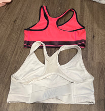 Load image into Gallery viewer, (2) Sports Bras UA Hot Pink Nike White Adult Small
