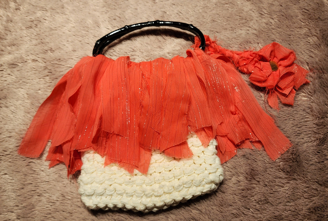 White Knit purse with coral ribbon trim and black handles