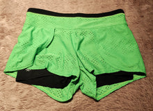 Load image into Gallery viewer, Athleta shorts, size XS, neon green with black liner, zip hip pocket, SUPER CUTE! XXS
