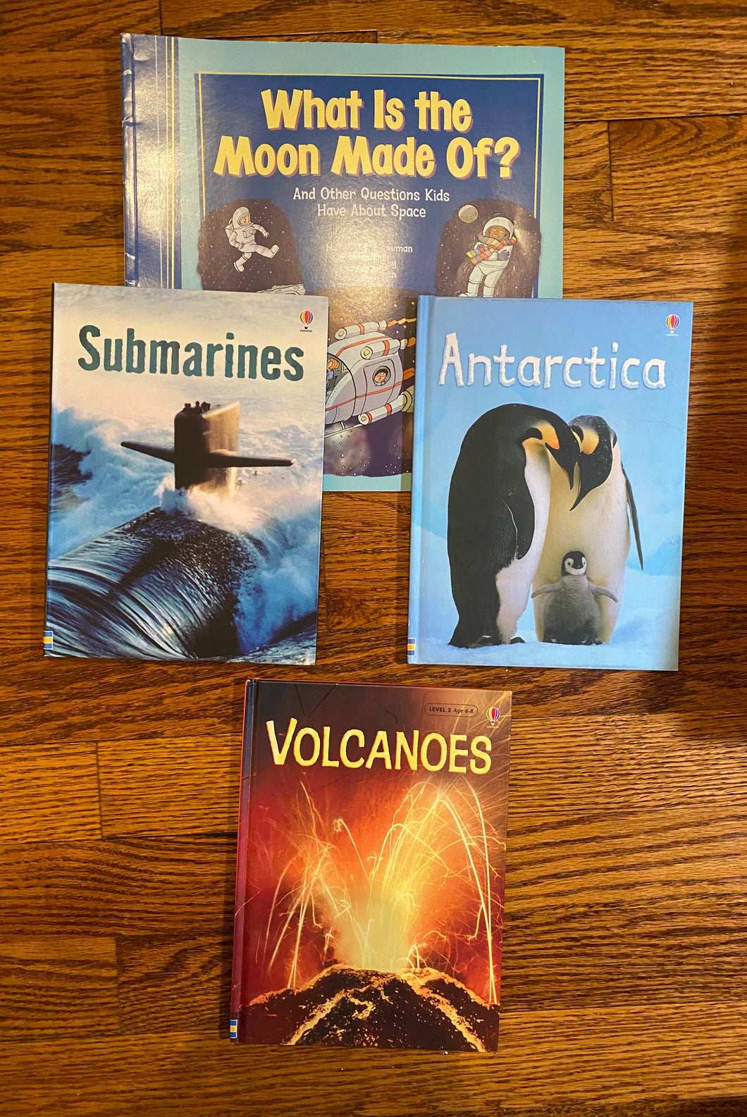 4 books, 3 are Usborne books (Submarines, Volcanos. Antarctica.