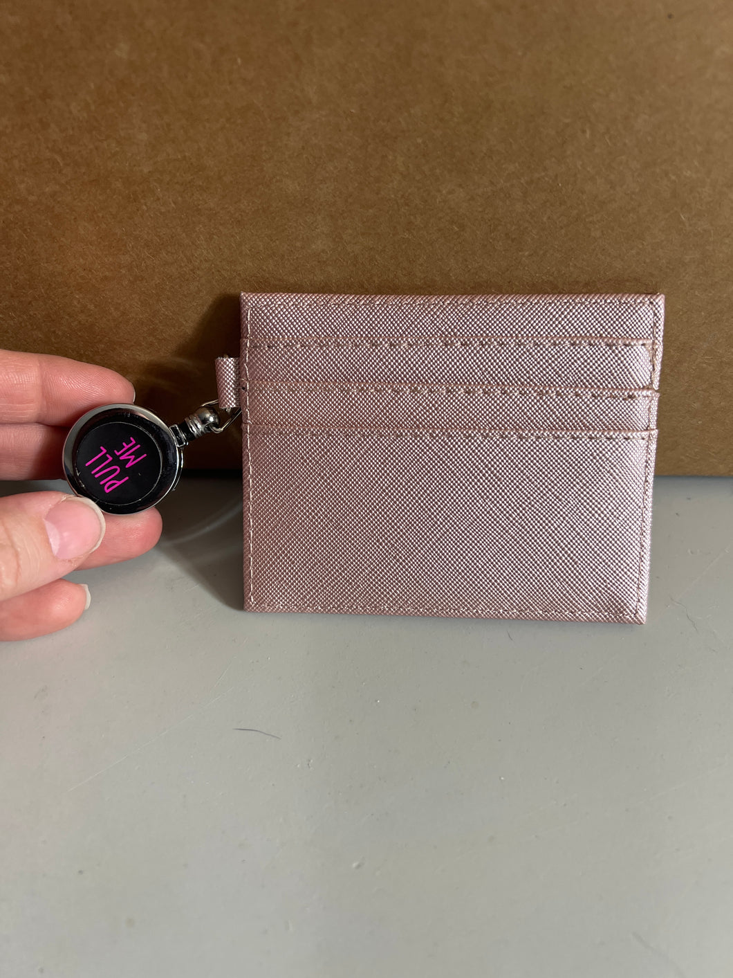 Pink ID holder with retractable holder