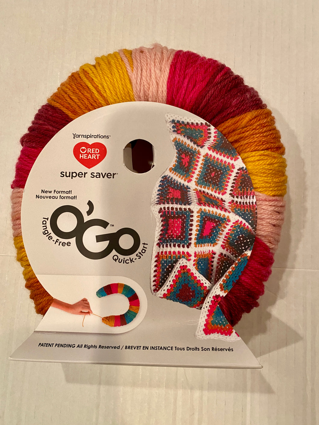 NWT red heart O’Go yarn in pink and gold 236 yards