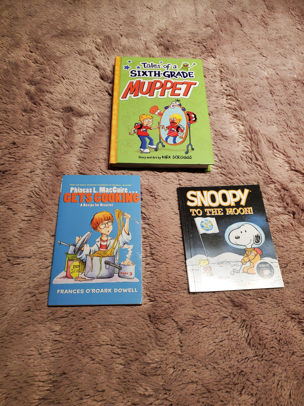 Lot of 3 books Muppet hardcover, Phineas McGuire Gets Cooking paperbacks, and bonus Snoopy to the Moon